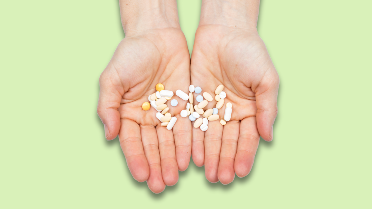 woman hand showing pills